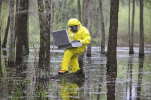 professional with mini lab in contaminated environment