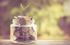 plant growing out of coins with filter effect retro vintage style