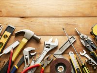 variety of tools on wood planks with copy space