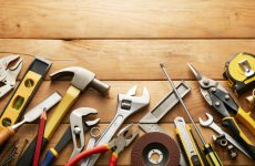variety of tools on wood planks with copy space